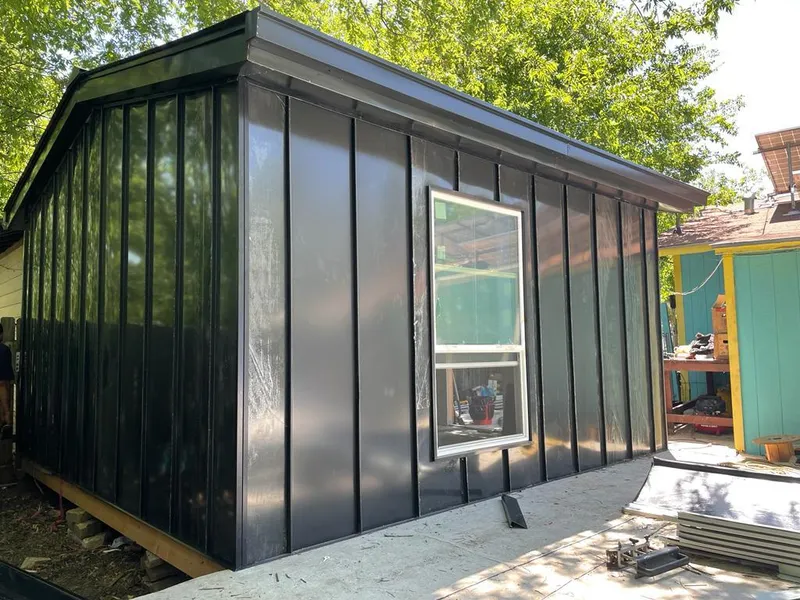 Black standing seam metal wall panels for Metal Roof Installation in Ligonier